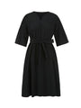 Black knee-length dress with wide pleated sleeves, V-neckline, and waist tie