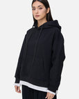 Stylish pairing with a black loose-fitting hooded sweatshirt