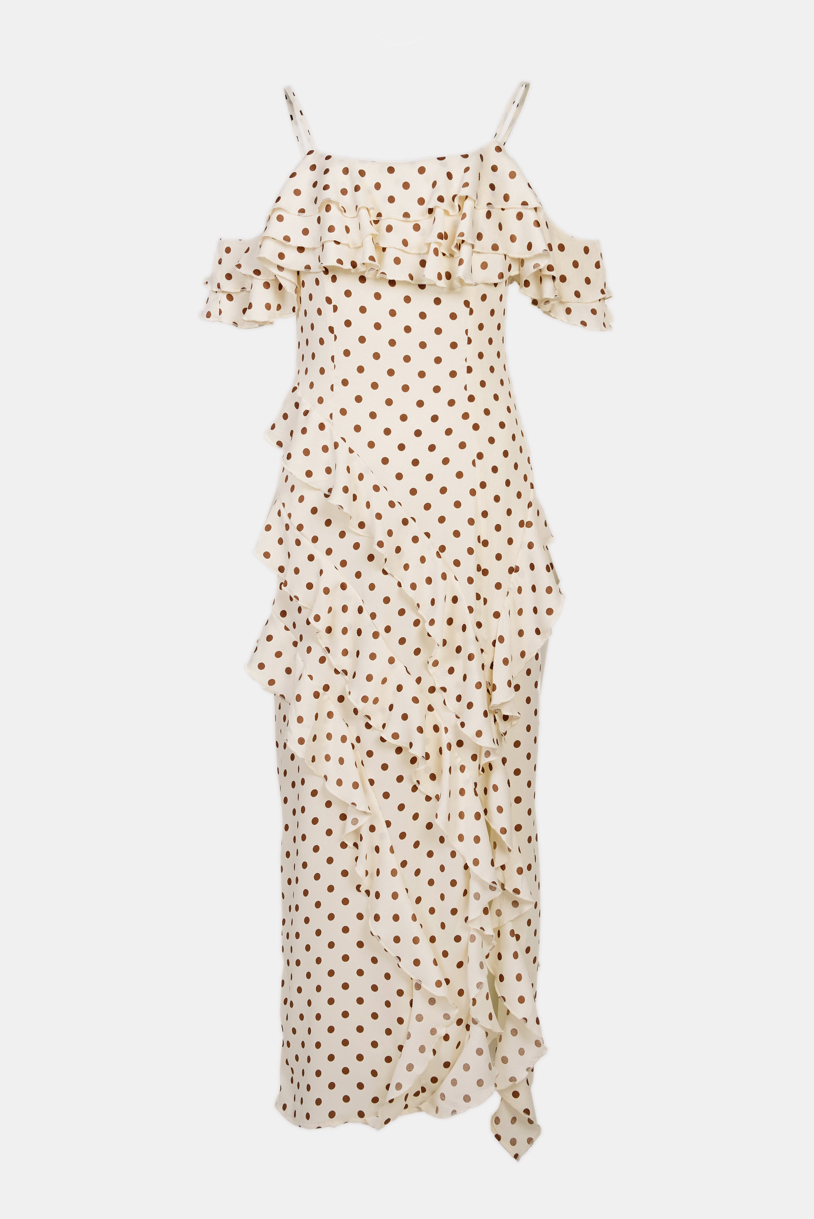 white polka dot dress with ruffled accents and an elegant yet playful design