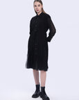 S·DEER black shirt dress, showcasing its flowy pleated silhouette and flattering waistline