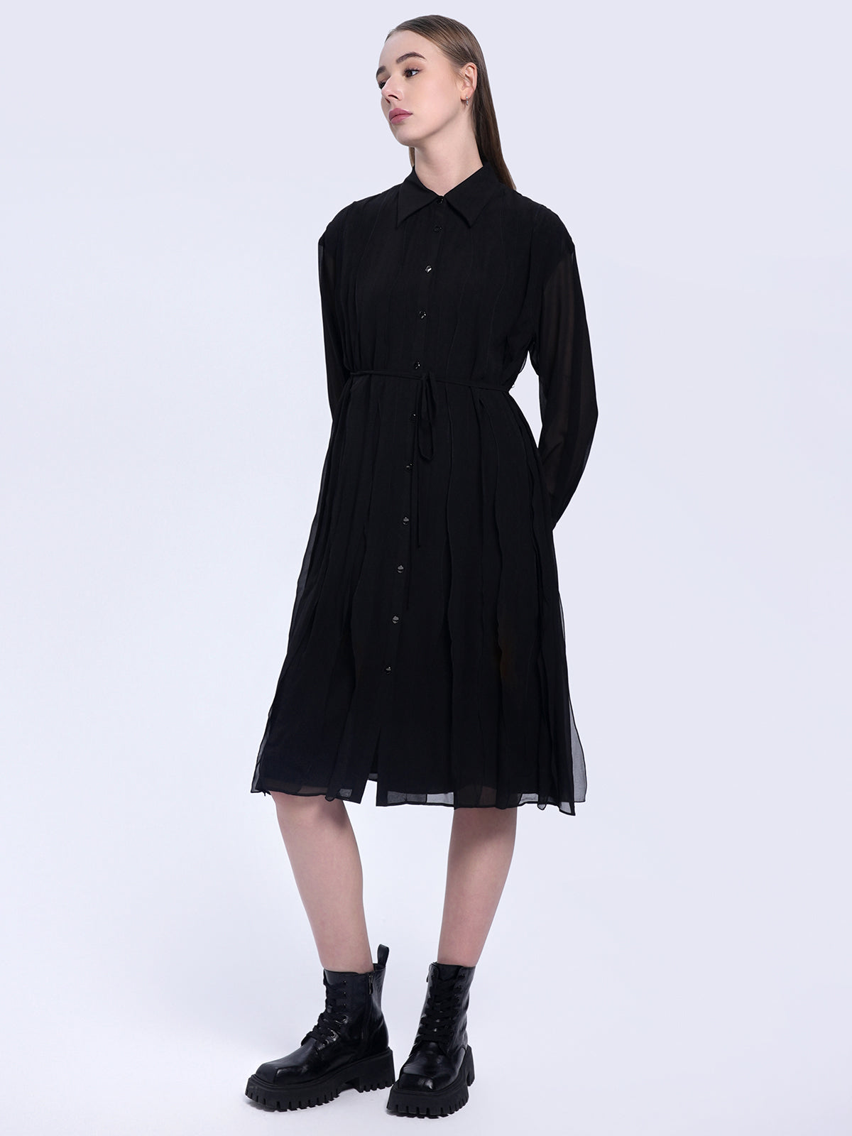 S·DEER black shirt dress, showcasing its flowy pleated silhouette and flattering waistline, adding a timeless and sophisticated touch to any wardrobe