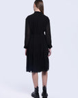 S·DEER black pleated shirt dress, emphasizing the minimalist design and pleats that provide movement and texture, ideal for versatile styling