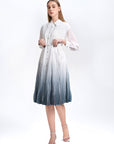 S·DEER shirt dress, showcasing the soft pleating and sleek silhouette